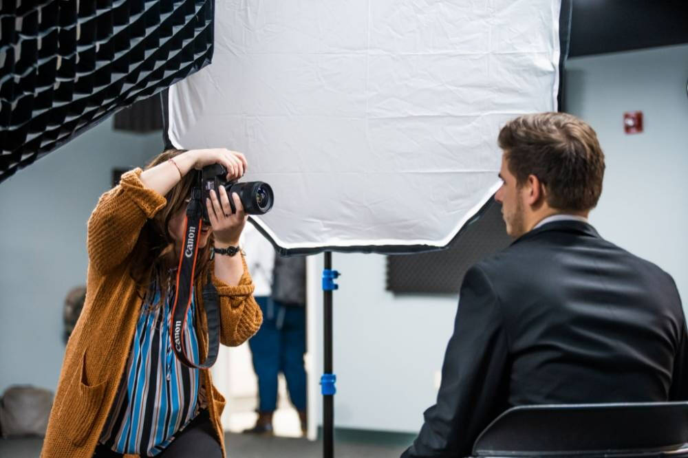 Photographer taking photo of man in a suit